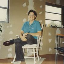 Jean in White Chair, Smiling
