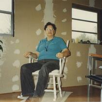 Jean in White Chair